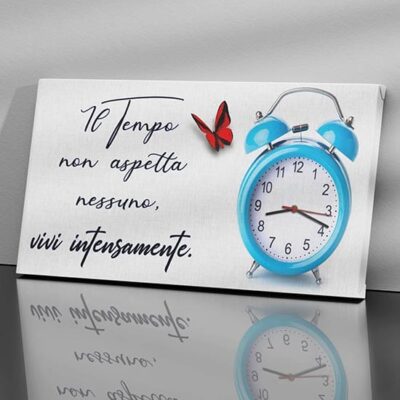 Orologio a muro su quadro con scritta su tela